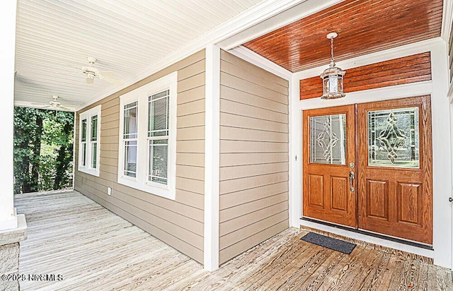 view of exterior entry with covered porch