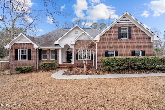 view of front of home featuring brick siding