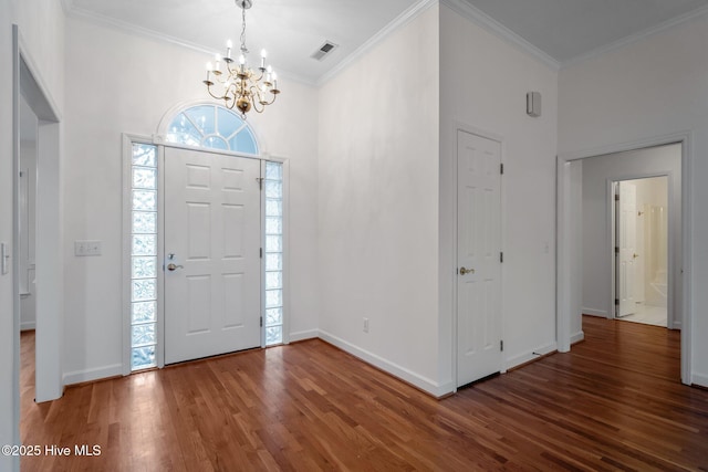 126 Francis Marion Dr, Wilmington, NC 28411 - foyer with baseboards, wood finished floors, visible vents, and crown molding
