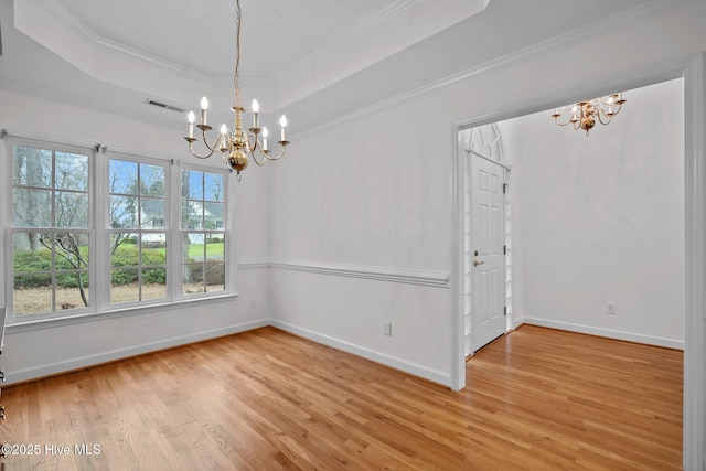126 Francis Marion Dr, Wilmington, NC 28411 - unfurnished dining area with light wood-style floors, a raised ceiling, and an inviting chandelier