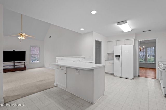 126 Francis Marion Dr, Wilmington, NC 28411 - kitchen with white appliances, white cabinets, lofted ceiling, light countertops, and a sink