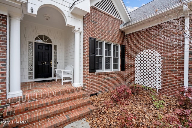 126 Francis Marion Dr, Wilmington, NC 28411 - property entrance featuring roof with shingles and brick siding