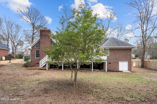 126 Francis Marion Dr, Wilmington, NC 28411 - rear view of property with a chimney, crawl space, brick siding, and a deck