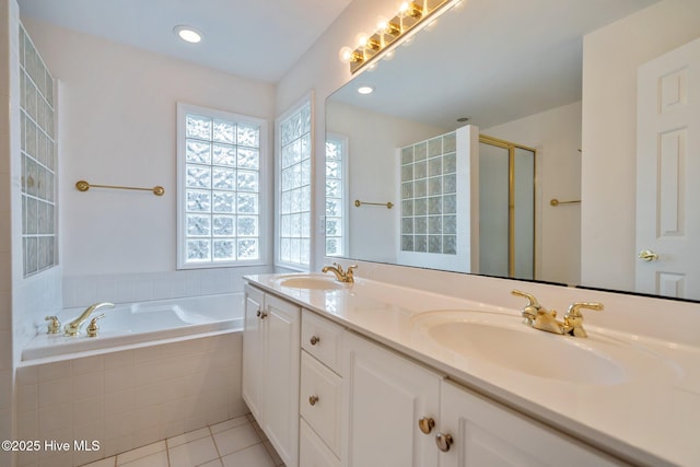 126 Francis Marion Dr, Wilmington, NC 28411 - full bathroom featuring a stall shower, tile patterned flooring, a garden tub, and a sink