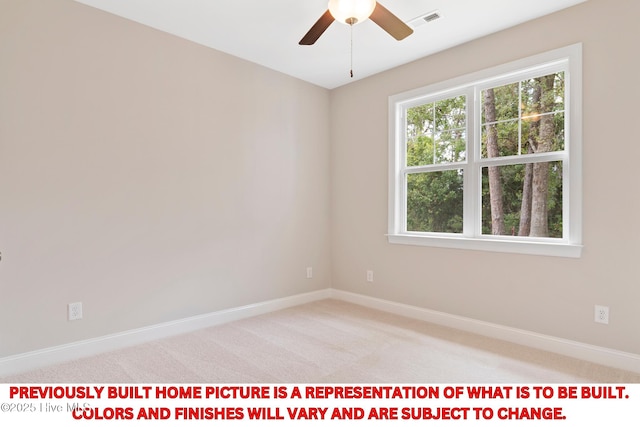 spare room with visible vents, light carpet, baseboards, and a ceiling fan