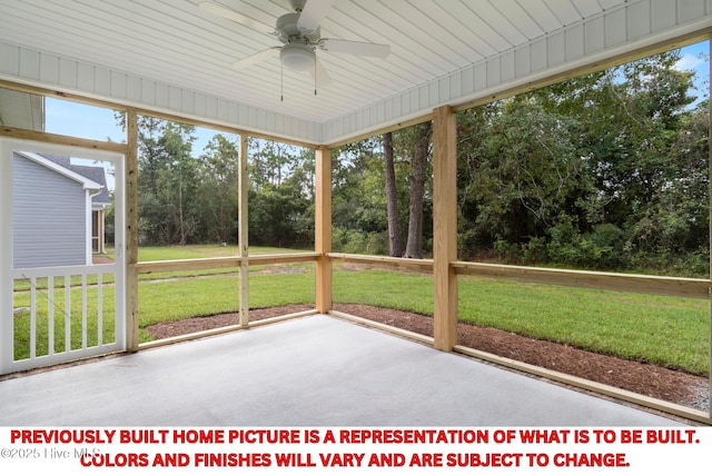 unfurnished sunroom with a healthy amount of sunlight and a ceiling fan