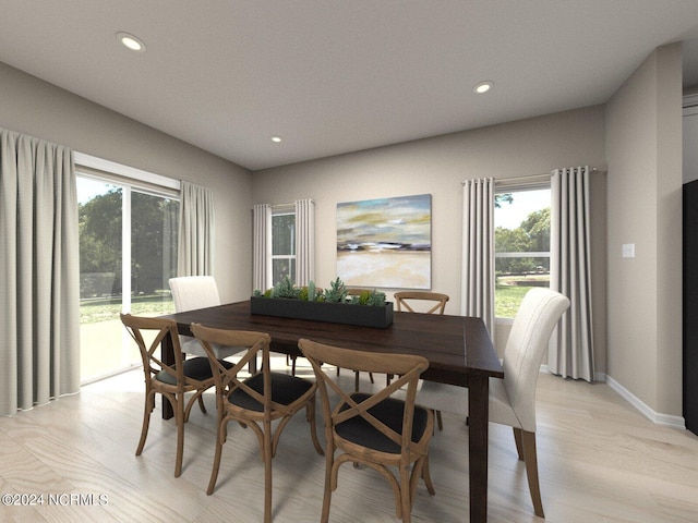 dining space with recessed lighting, light wood-style flooring, and baseboards