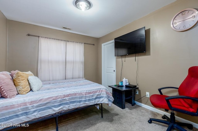 bedroom with carpet, visible vents, and baseboards