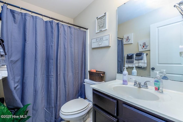 full bath featuring toilet and vanity