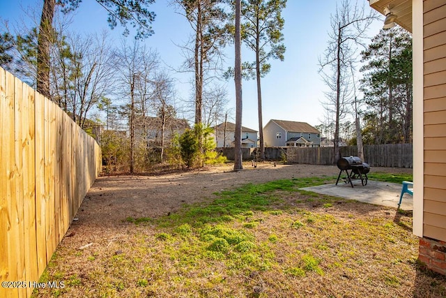 view of yard featuring a fenced backyard and a patio