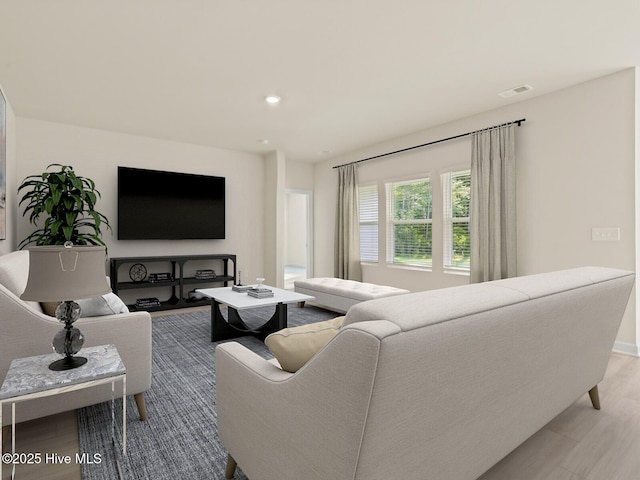 living room featuring light wood-type flooring, baseboards, visible vents, and recessed lighting