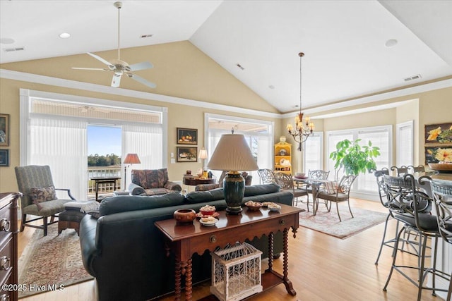 living area with a wealth of natural light, visible vents, and light wood-style flooring