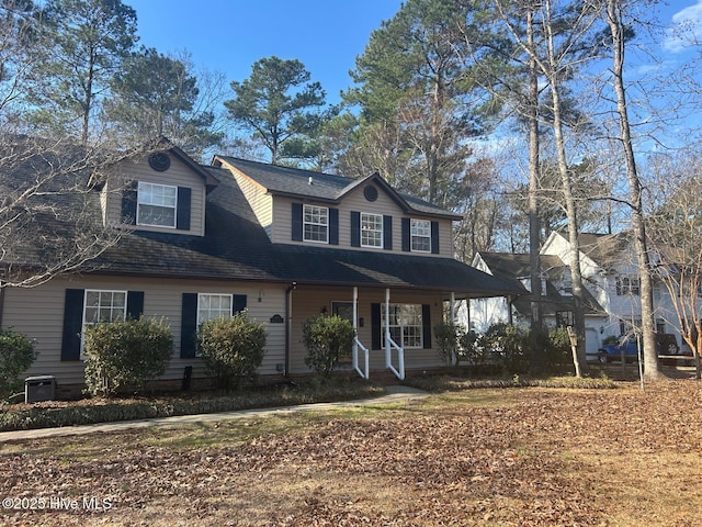 view of front of property with a porch and a shingled roof