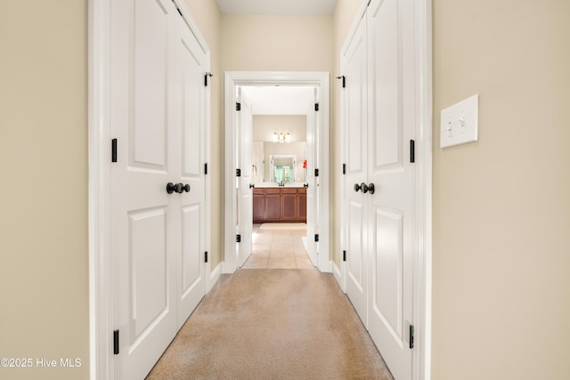 hallway with light carpet