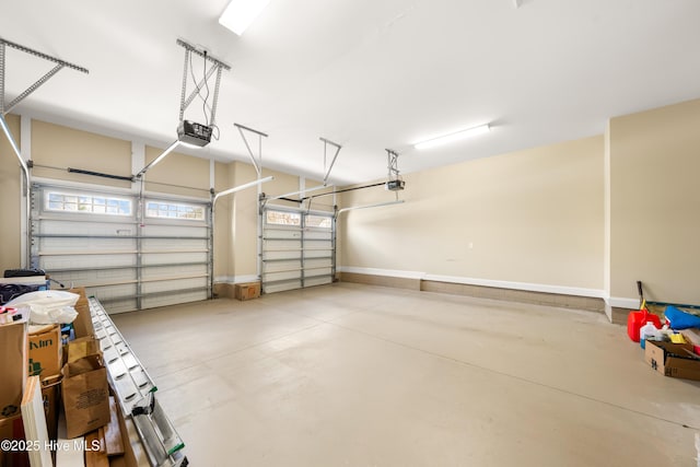 garage featuring baseboards and a garage door opener