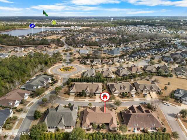 bird's eye view featuring a water view and a residential view