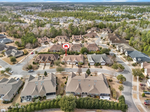 birds eye view of property with a residential view