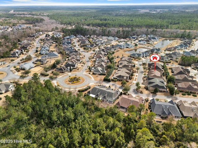 aerial view with a residential view and a view of trees