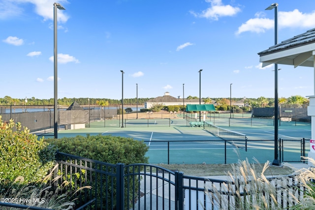 view of sport court featuring fence