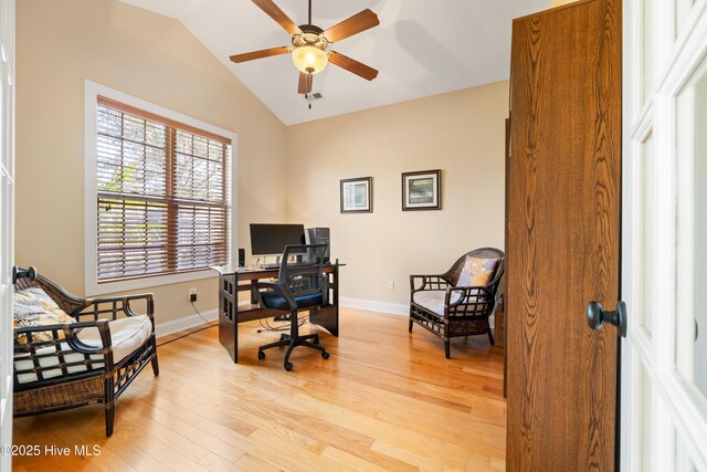 office featuring vaulted ceiling, light wood-style flooring, baseboards, and ceiling fan