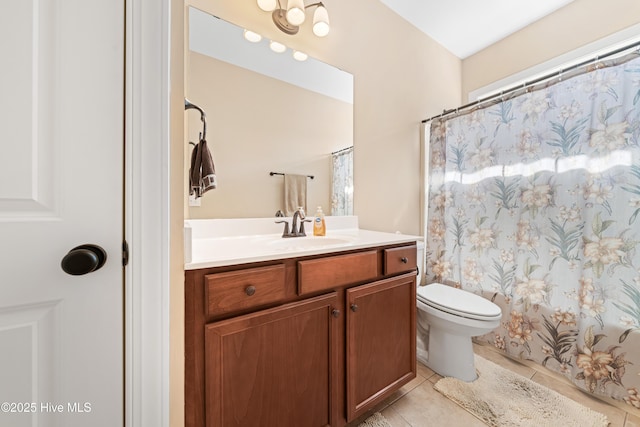 full bath featuring toilet, tile patterned floors, a shower with shower curtain, and vanity