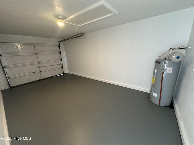 garage with electric water heater and baseboards