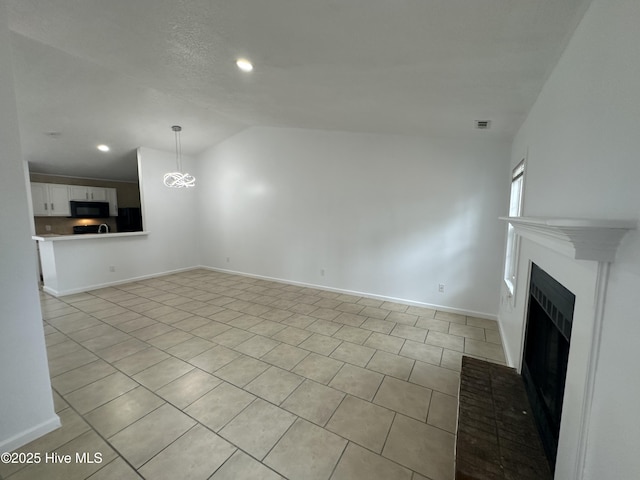 unfurnished living room with a fireplace, recessed lighting, visible vents, vaulted ceiling, and baseboards