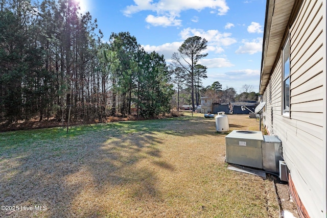 view of yard featuring central AC unit