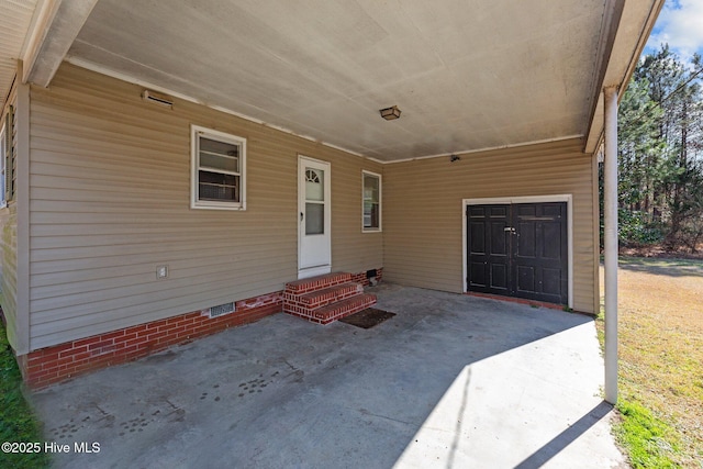 entrance to property with a carport