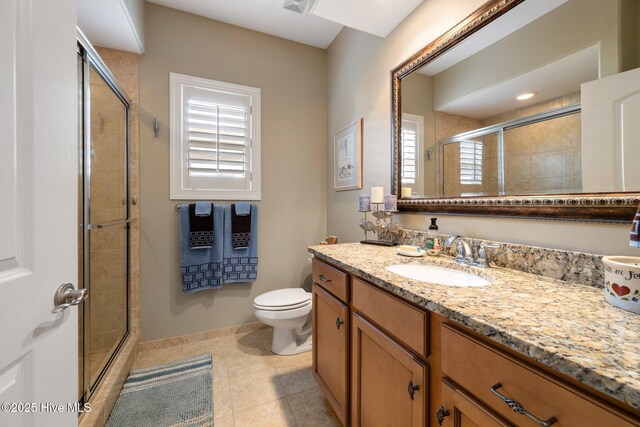 half bathroom featuring visible vents, baseboards, toilet, and wood finished floors