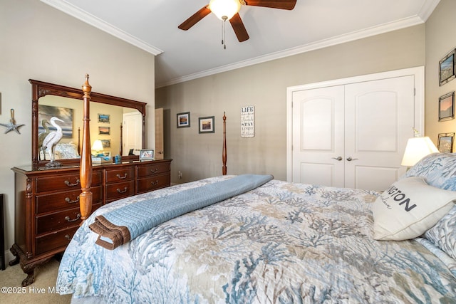 bedroom featuring a closet, carpet, ornamental molding, and a ceiling fan