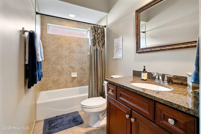 full bathroom with tile patterned flooring, toilet, vanity, and shower / bath combo