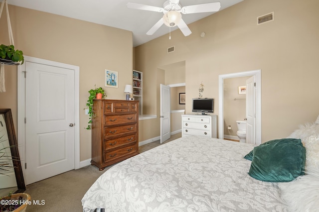 bedroom featuring lofted ceiling, carpet floors, visible vents, and a ceiling fan