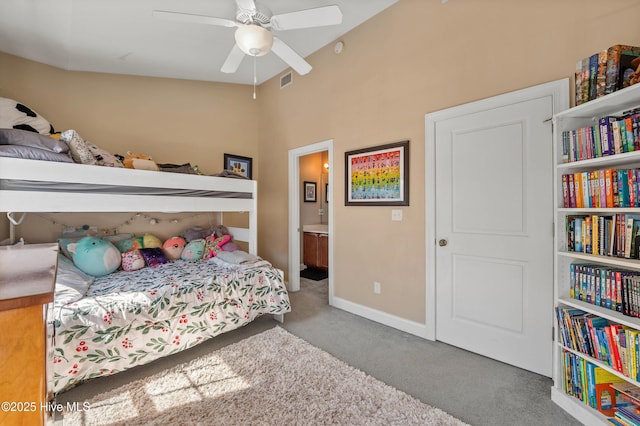 bedroom featuring ensuite bathroom, carpet flooring, a ceiling fan, and baseboards