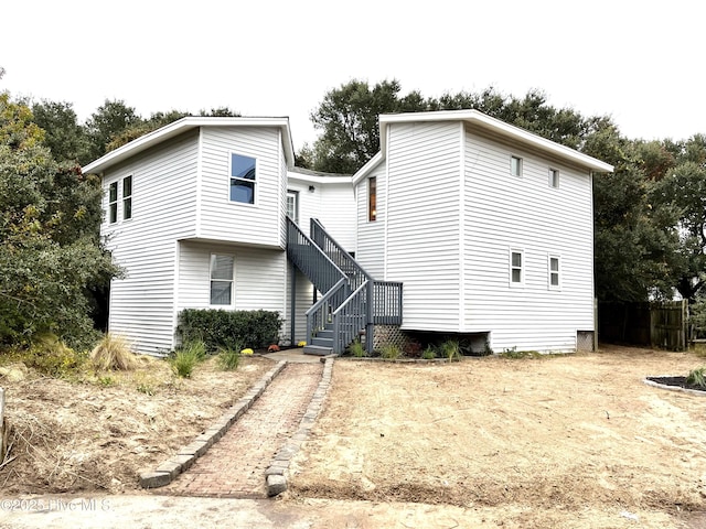 view of front of house with stairs