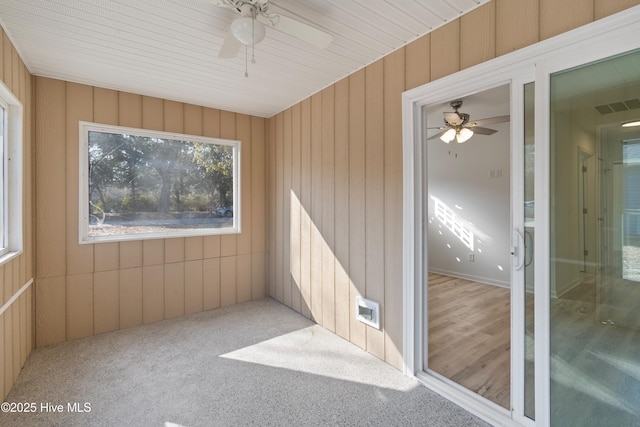 unfurnished sunroom with ceiling fan and visible vents