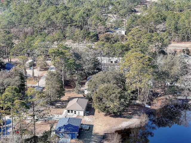 drone / aerial view featuring a forest view