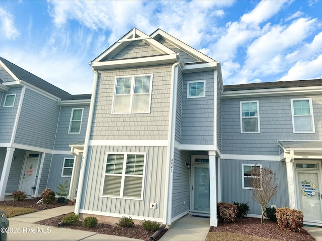 townhome / multi-family property featuring board and batten siding