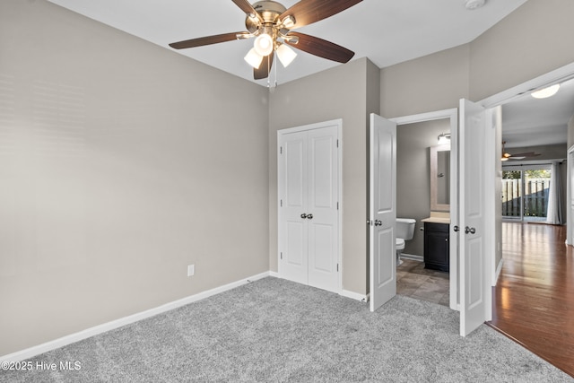 unfurnished bedroom featuring a ceiling fan, carpet, and baseboards