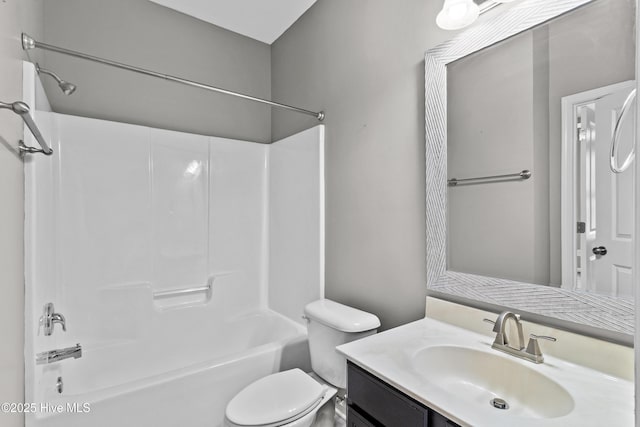 bathroom featuring shower / bathtub combination, vanity, and toilet