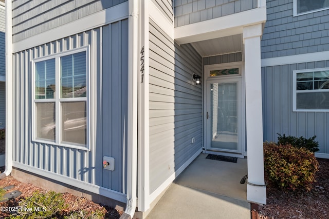 entrance to property featuring board and batten siding