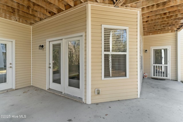 doorway to property with a patio