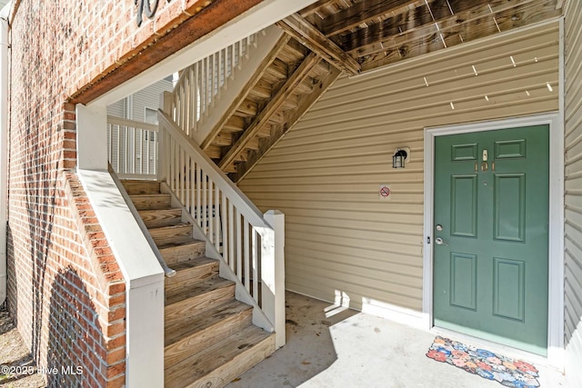 entrance to property with brick siding