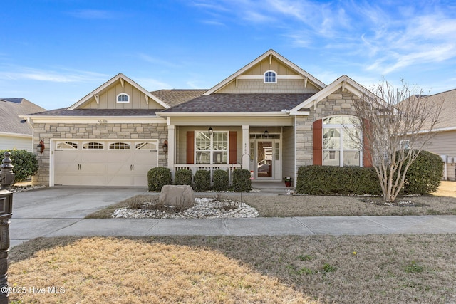 craftsman-style home featuring a porch, an attached garage, a shingled roof, concrete driveway, and stone siding