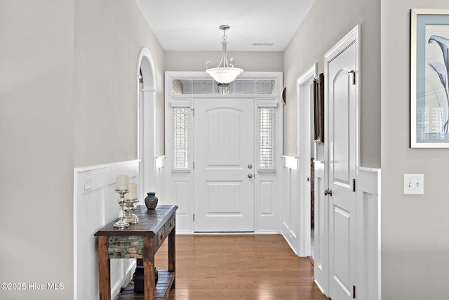 entryway featuring visible vents and dark wood finished floors