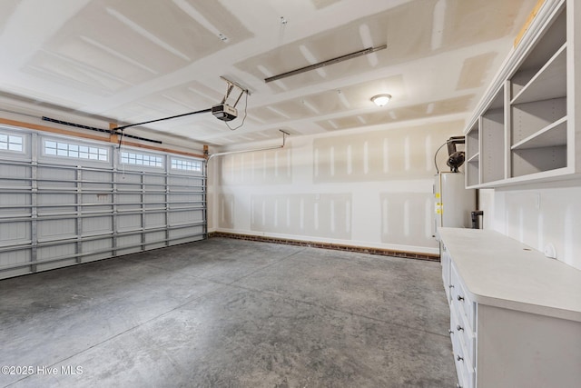 garage with water heater and a garage door opener