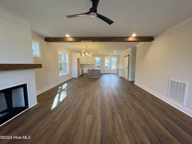 unfurnished living room featuring beam ceiling, a fireplace, dark wood finished floors, and visible vents