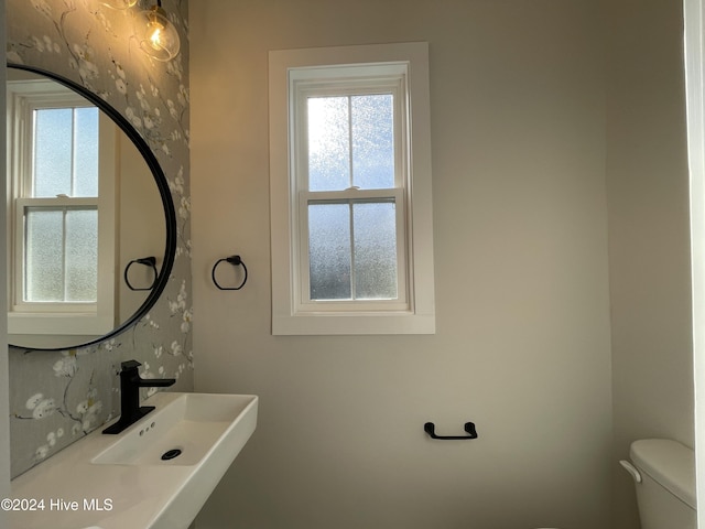 bathroom featuring toilet and a sink