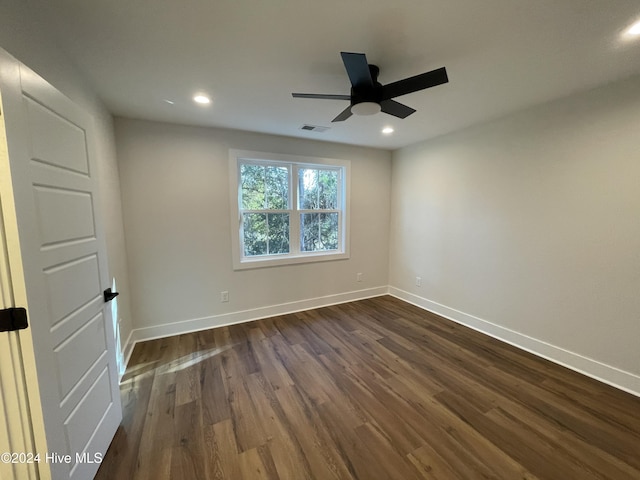 unfurnished room featuring baseboards, visible vents, dark wood finished floors, ceiling fan, and recessed lighting