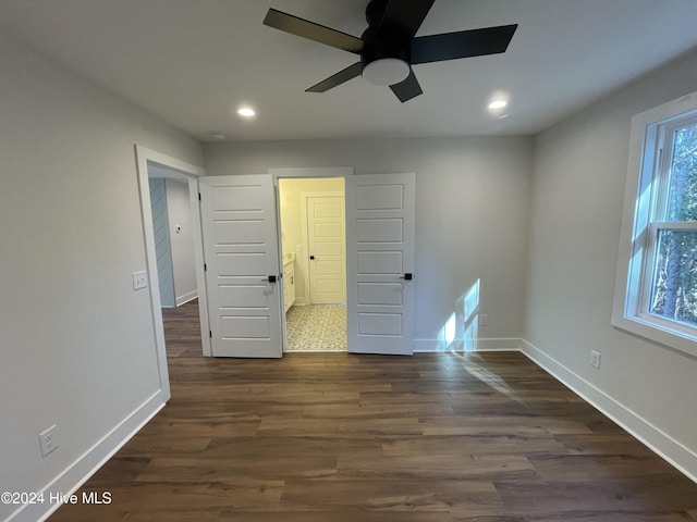 empty room with recessed lighting, dark wood-style flooring, ceiling fan, and baseboards